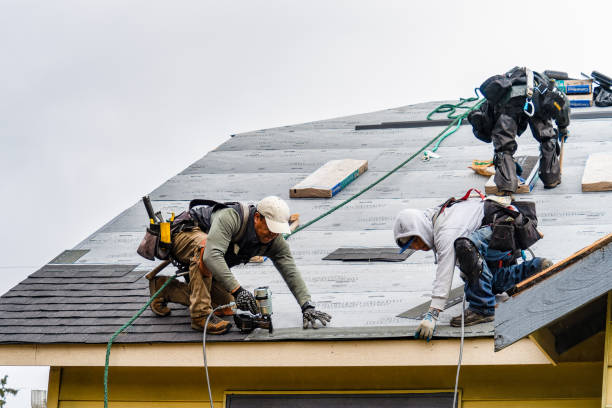 Professional Gutter Installation technician working in Metaline Falls, WA